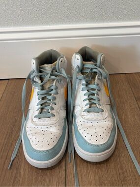Nike White and Blue High-Top Sneakers with Yellow Accents.
Make me an offer :)